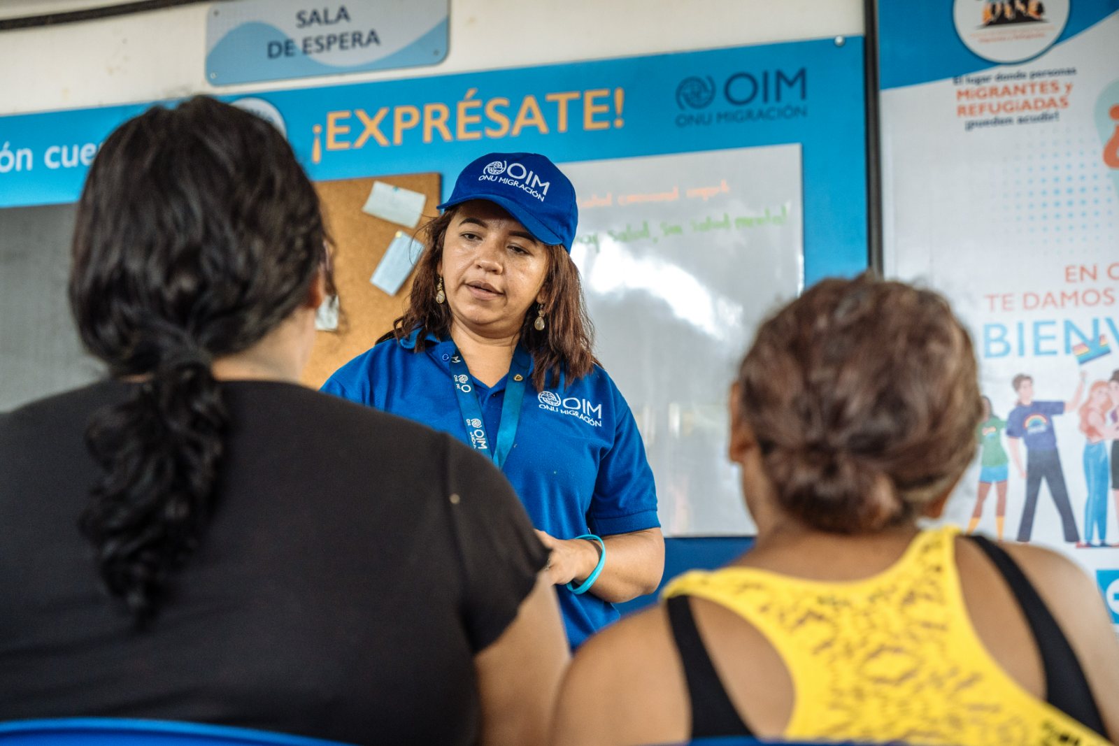 An IOM colleague supporting migrants